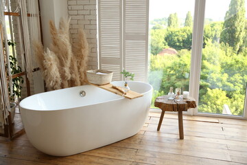 white bathroom near a large window