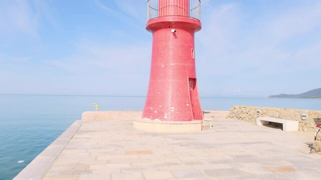 Harbor view with red lighthouse