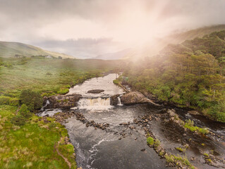 Aerial view on Aasleagh water fall in county Mayo, Ireland. Beautiful Irish landscape, Sun flare....