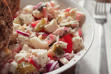 Small bowl with fresh crab stick salad. Close up, Selective focus, Sea food healthy option concept.