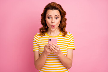 Close-up portrait of her she nice attractive lovely amazed addicted cheerful cheery wavy-haired girl influencer browsing web media smm share isolated over pink pastel color background