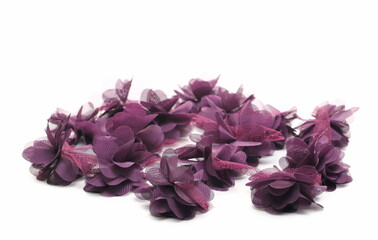 Purple fabric flowers with lace, clothing accessory isolated on white background