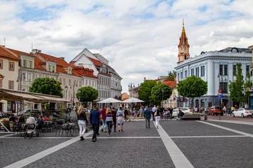  Streets of the old city Vilnius Narrow streets and beautiful facades. Citizens and tourists walk, sit in cafes and see the sights of the city Summer 2020, after quarantine. Walk in the city. Good mood © Dmitry Koshelev