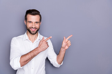Portrait of positive cheerful man marketer ceo point index finger copyspace recommend suggest...