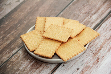 dry square sweet cookies in plate