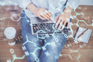 Science formula hologram with man working on computer on background. Education concept. Double exposure.