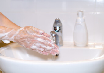 Washing hands with soap foam and water. Hygiene cleaning.