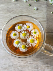 herbal tea with chamomile in a transparent cup