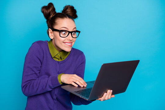 Close-up portrait of nice attractive smart clever comic childish cheery foxy girl holding in hands laptop writing e-mail isolated bright vivid shine vibrant blue green teal turquoise color background