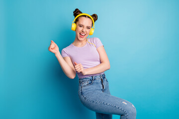 Photo of cheerful crazy cool lady two funny buns good mood listen modern earphones popular music...