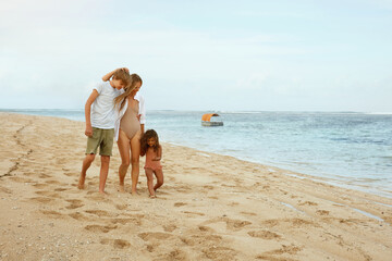 Summer. Family On Beach Portrait. Young Woman With Kids Enjoying Summertime At Tropical Resort. Brother, Sister And Mother On Vacation Near Ocean. Happiness As Lifestyle.