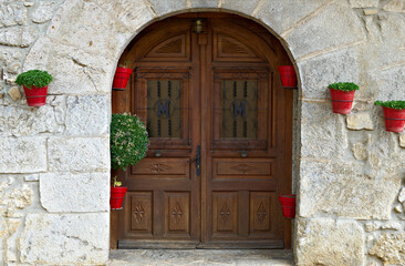 Fototapeta na wymiar Wooden door of a Spanish house