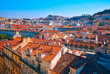 Naklejka premium Rooftops and hills in an aerial view of Lisbon.