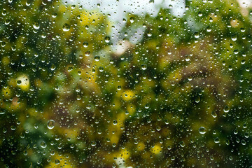 Rain drops on window pane glass surface
