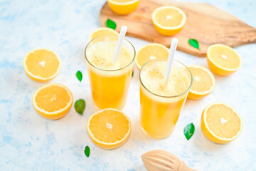 oranges for making juice, pattern, on a blue background