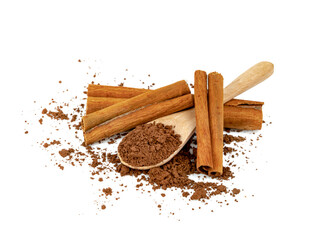 Cocoa powder and cinnamon sticks  with wooden spoon isolated on white background