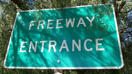 Obraz premium Freeway entrance sign on interchange crossraod in San Diego county, California USA. State Route highway 78 signpost plate. Symbol of road trip, transportation and traffic safety rules and regulations