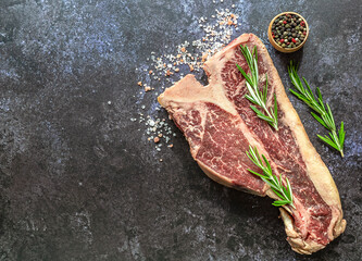 Thick Raw T-Bone Steak preparing for grill or bbq