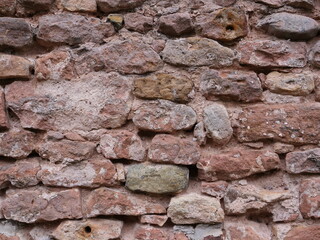 A wall of pink stone. A typical stone of the Vosges, in the east of France.