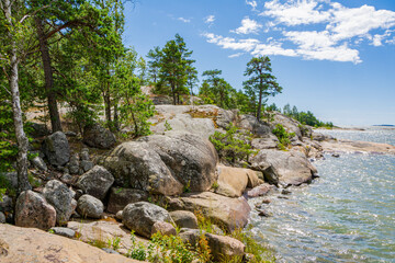 Fototapeta na wymiar Rocky coastal view and Gulf of Finland, trees, shore and sea, Kopparnas-Storsvik recreation area, Finland