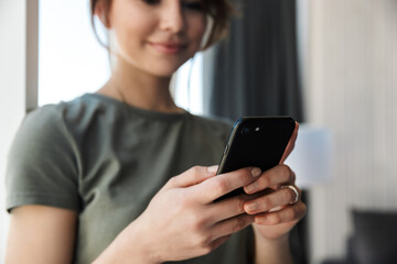 Attractive young woman using mobile phone