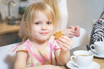 Portrait of a cute little girl in the kitchen
