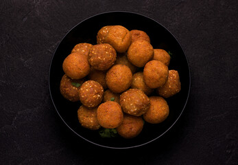 Falafel dish of deep-fried balls of crushed legumes, seasoned with spices.