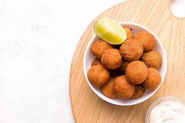 Middle Eastern food. Fried falafel on a light background