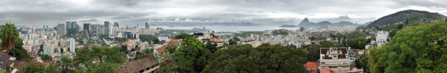 Fototapeta premium Rio de Janeiro, Brazil: 270 degrees panoramic view from the Ruins Park in Santa Teresa on a rainy and clouded day.