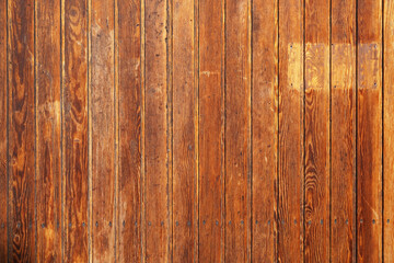 old rustic wood paneling background with vertical wooden boards or planks