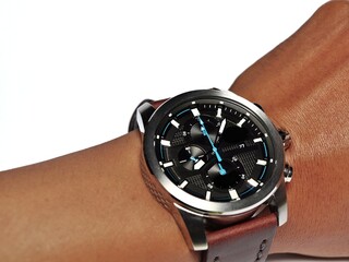 Hand wearing luxury wristwatch