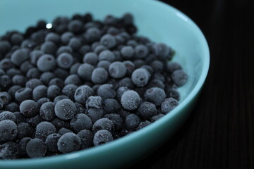 frozen blackberry on blue plate