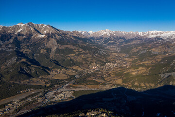 Fototapeta na wymiar Sky view of mountains and a village, Uvernet-Fours, aples-de-haute-provence
