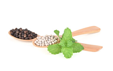 Black pepper and White pepper spice was placed on a white background