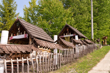Fototapeta na wymiar Ethno village in the mountains, wooden houses, spring time