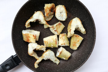 Pieces of fried navaga