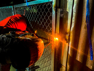 welder connects metal parts to complex structures using electric welding.Selective Focus