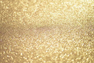 Sparkling gold bokeh background, gold color. Gold sequins background.