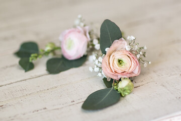 simple pink rose groom boutonniere