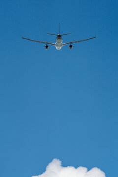 Vertical image of Passenger airplane with blue sky background