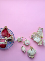 Garlic on a pink background