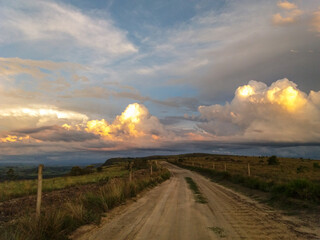 Sunset colors reflected on the cloulds at the mountains of brazilian countryside.