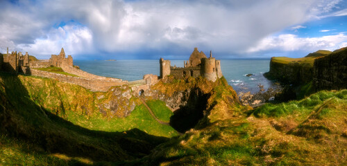Dunluce Castle is a medieval castle in Bushmills Northern Ireland - panorama © janmiko