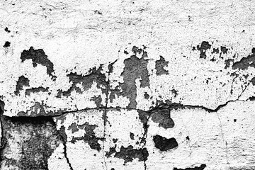 Texture of a concrete wall with cracks and scratches which can be used as a background