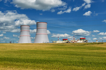 Fototapeta na wymiar Nuclear power plant, cooling towers and power lines in Ostrovets, Grodno region, Belarus.