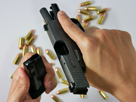 Short guns and ammunition placed on white background.Guns and ammunition are ready to use.