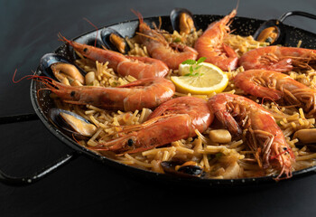 Seafood noodles detail seen close up, macro - fideua