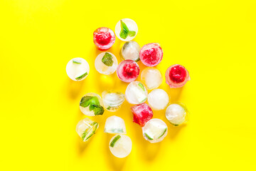 Berries and mint in ice cubes top view