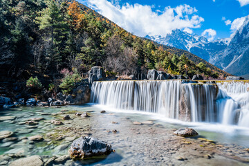 Scenery of Blue Moon Valley Waterfall in Yulong Snow Mountain, Lijiang, Yunnan, China