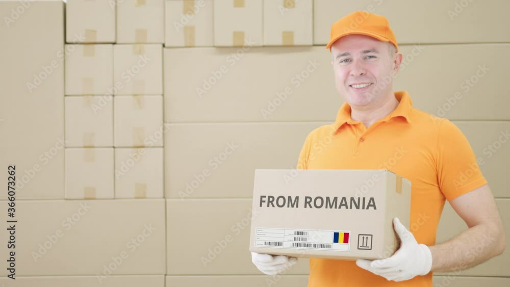 Poster warehouse worker holds cardboard box with printed from romania text on it